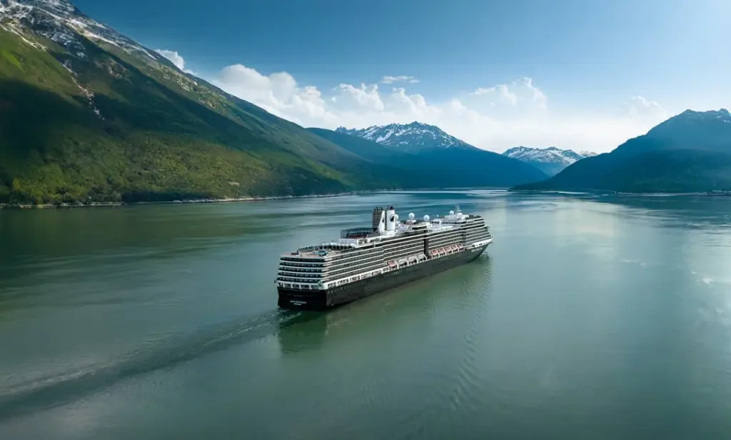 Cruise ship sailing through an Alaska inside passage fjord