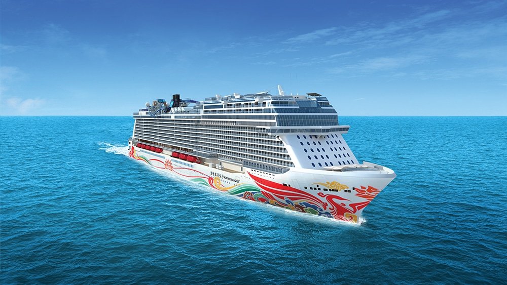Cruise ship sailing across turquoise open sea