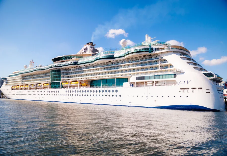 Cruise ship docked under a blue sky