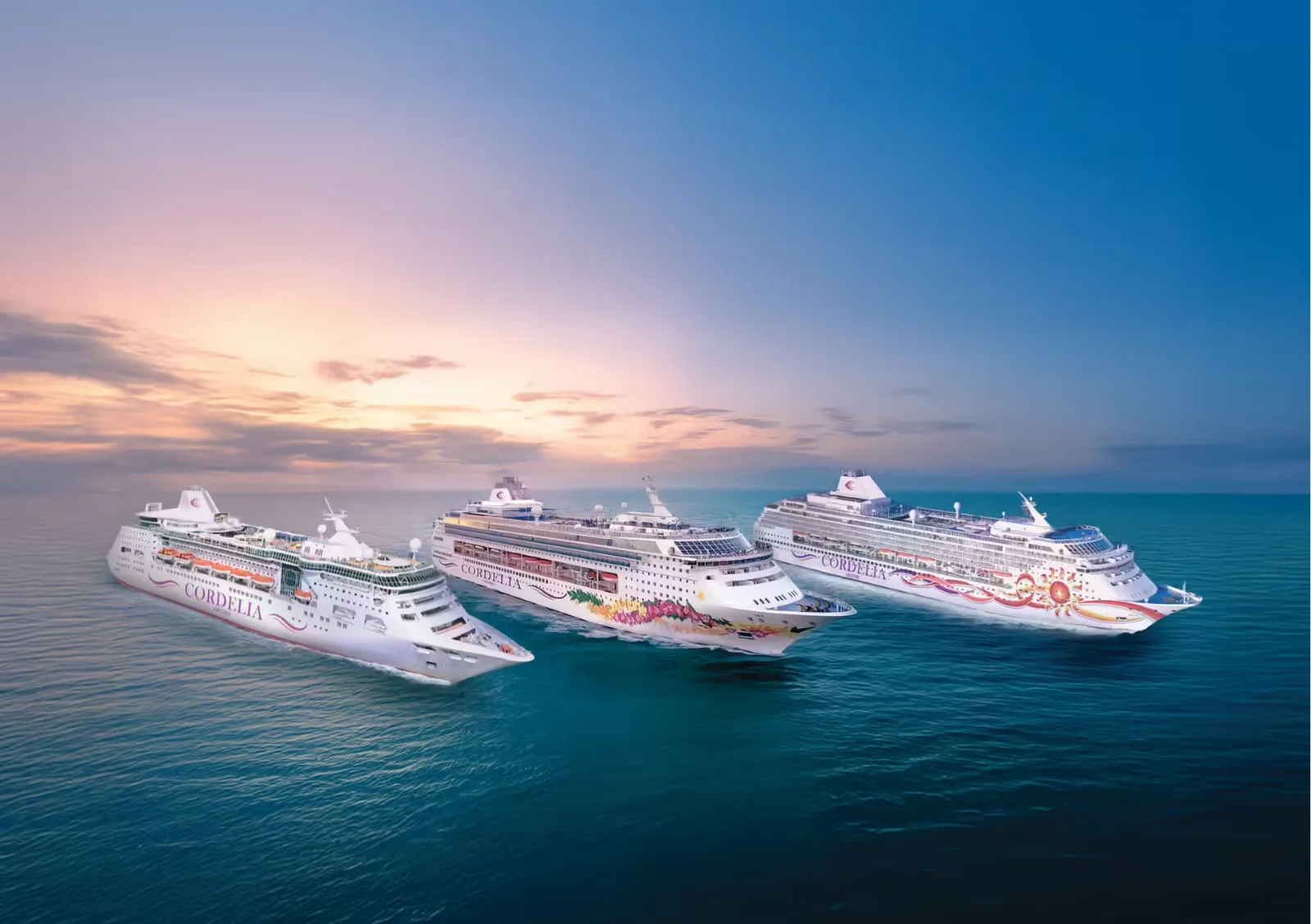 Three cruise ships at sea at sunset